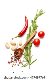 Food and drink healthy lifestyle concept: Italian herbs and spices. Rosemary, tomatoes, garlic and peppers. Top view. Isolated on white.