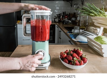 Food and drink. Making fresh organic strawberry cocktail in vintage retro blender - Powered by Shutterstock