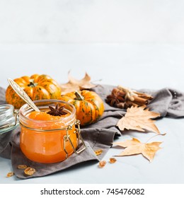 Food and drink, still life, thanksgiving harvest fall autumn concept. Pumpkin jam or confiture with spices on a cozy kitchen table. Copy space background