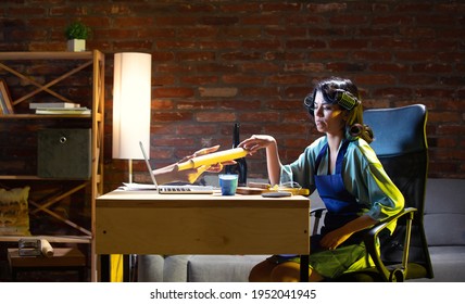 Food, Drinks, Cuisine. Young Caucasian Woman During Online Cooking Lesson Through Laptop At Home. Virtual Reality. Concept Of Remote Safe Entertaiments, Meetings During Quarantine. Copy Space For Ad.