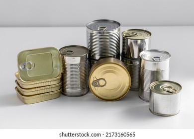 Food, Eating And Preserve Concept - Close Up Of Tin Cans With Preserves On Table