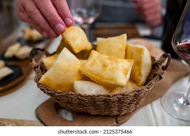 Food of Emilia Romagna region, deep fried bread gnocco fritto or crescentina served in restaurant in Parma, Italy close up