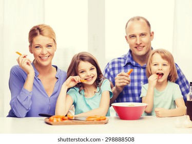 Food, Family, Children, Hapiness And People Concept - Happy Family With Two Kids Eating At Home