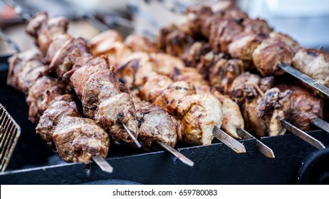 Food At The Festival Of Street Food, Sausages, Hot Dog, Fried Potatoes, Shish Kebab, Fried Meat, Fried Corn And Various Drinks