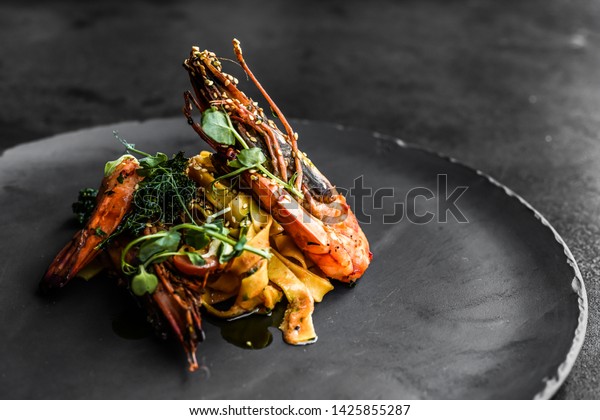 food fish elegant gourmet black plate top view\
lunch dinnerdish meal fine dining closeup green sea seafood shrimp\
beautiful modern