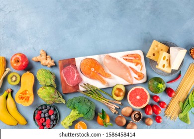 Food, A Flatlay Composition Of Many Different Products, With Meat, Fish, Chicken And Shrimps, Vegetables And Fruits, Pasta, Mushrooms, And Cheese, Shot From Above With A Place For Text