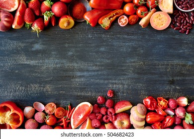 Food Frame Constructed With Red Fruits And Vegetables, Fresh Raw Organic Produce On Dark Distressed Background