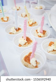 Food Free Sample. A Small Bite Piece Of Souffle Pancakes With Fresh Cream In Small Plastic Takeaway Cup For Customers To Try. Soft Focus On The Pancake With Pink Toothpick.