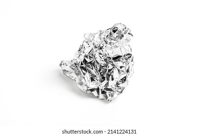 Food Grade Aluminum Foil Paper For Chocolate Packaging. Shiny Aluminum Wrap Without Chocolate Candy Isolated On A White Background. Texture Of Used Crumpled Aluminium Food Foil.