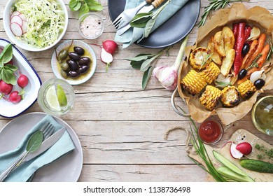 Food Grilled Vegetables Outdoor Table Family Dinner Potato Wedges Roasted Corn Party Picnic. Overhead View, Copy Space