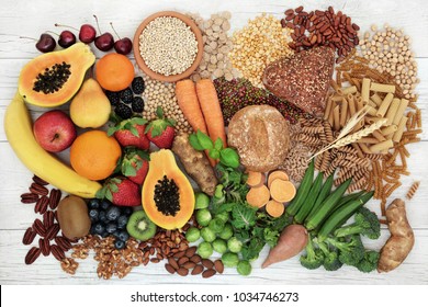 Food with high fiber content for a healthy diet with fruit, vegetables, whole wheat bread, pasta, nuts, legumes, grains and cereals. High in antioxidants, anthocyanins, vitamins and omega 3 fatty acid