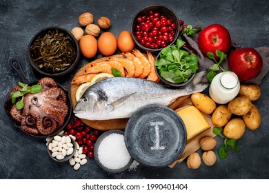 Food high in iodine on dark gray background. Healthy eating concept. Top view, flat lay