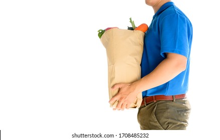 Food And Home Delivery Service. Thai Deliveryman Holding Fresh Food Isolated On White Background. Path And Cut Out. Self-quarantine And Stay At Home.