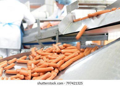 Food Industry: Workers In The Production Of Original German Bratwurst In A Large Butcher's Shop 