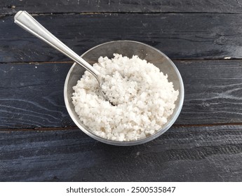 Food ingredient coarse table salt in spoon on the wooden table  - Powered by Shutterstock