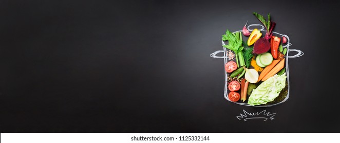 Food Ingredients For Blending Creamy Soup On Painted Stewpan Over Black Chalkboard. Top View With Copy Space. Organic Vegetables, Spices, Herbs. Vegetarian, Vegan, Detox, Clean Eating Concept.