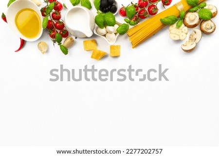 Food ingredients for cooking Italian pasta. Fresh cherry tomatoes, mushrooms, garlic, basil leaves, parmesan and mozzarella cheese, spaghetti, olive oil and cream on white background top view ストックフォト © 