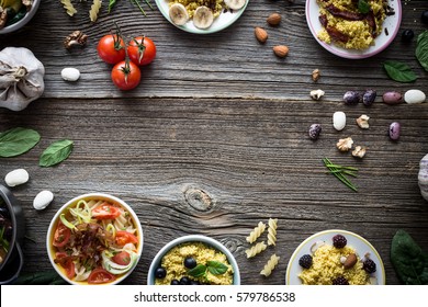 Food And Ingredients With Empty Space For Designs On Wooden Background. Overhead Shot.