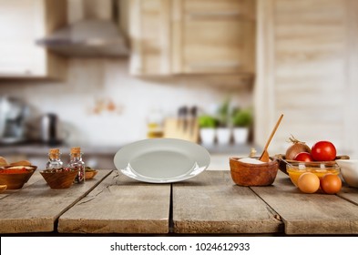 Food Ingredients In Kitchen Placed On Wooden Plank. Empty Plate, Ideal For Product Placement. Very High Resolution Image