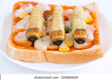 Food Insects: Worm Beetle Or Witchetty Grub For Eating As Food Items Made Of Cooked Insect Meat On Bread Baked Sandwich On Plate, It Is So Rich In Protein Edible And Delicious. Entomophagy Concept.