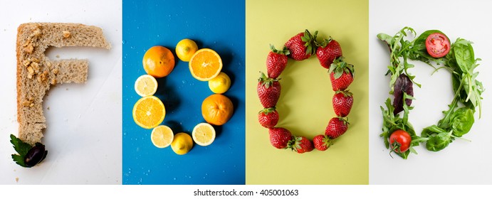 Food Letters Made Of Bread, Oranges, Lemon, Strawberries And Green Salad