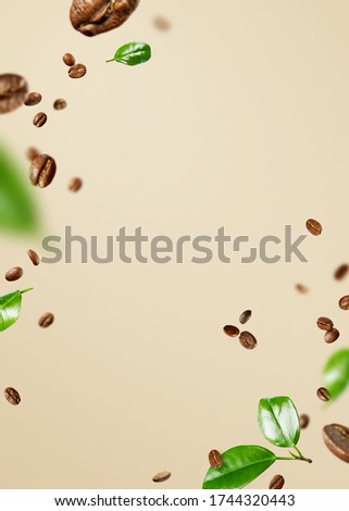 Food Mockup with flying coffee beans and leaves on a beige background with copy space.