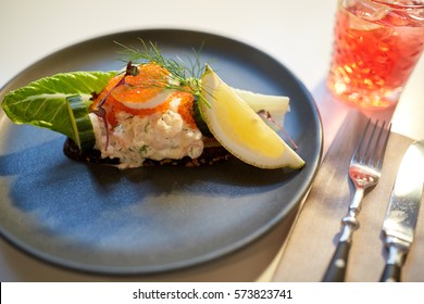 Food, New Nordic Cuisine, Culinary And Cooking Concept - Close Up Of Toast Skagen With Shrimps, Fish Roe And Buttery Bread On Plate