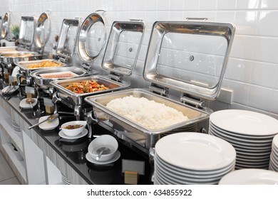 Food On Buffet Table With Dishware