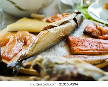 The food is on the Faroese table: fish, fruit, dried pilot whales. Faroe Islands. Kingdom of Denmark. Northern Europe - Shutterstock ID 2101684294