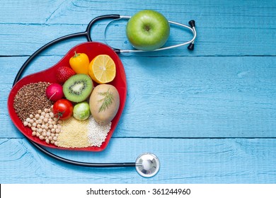 Food On Heart Plate With Stethoscope Cardiology Concept On Blue Boards