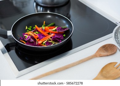 Food On A Induction Cooktop In Kitchen At Home