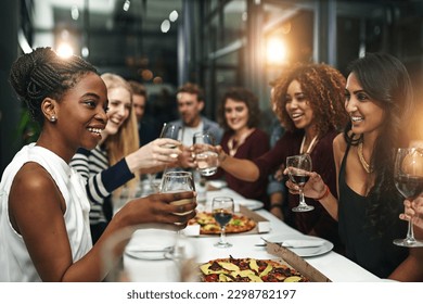 Food, party and wine with friends at restaurant for celebration, pizza and social event. Happy, diversity and toast with group of people eating together for fine dining, cheers and free time - Shutterstock ID 2298782197