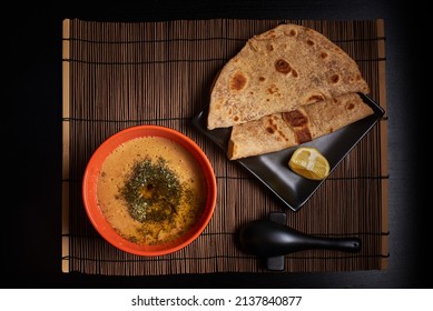 Food Photo, Turkish Lentil Soup In A Bowl With Two Slices Of Chapati Bread, Oriental Turkish Menu Meal Vegan Dish, Vegetarian Food Top View On Ark Background Photo