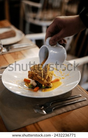 Food photography is an area of photography where food is photographed as the main subject for still images. A subset of commercial photography, the images are then used in product packaging, cookbooks