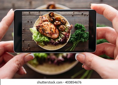 Food photography of baked pork with fresh vegetables. Home made food photo for social networks. Top view mobile phone photo of baked meat.  - Shutterstock ID 403854676