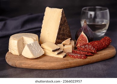 Food photography of cheese; soft; goat; sheep; parmesan, fig; white; wine; dried; salami; paprika - Powered by Shutterstock