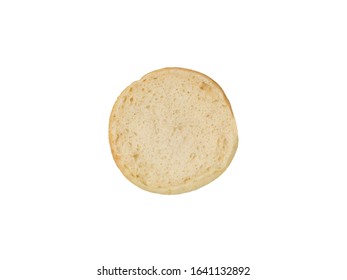 Food Photography Of Half A Plain Untoasted Traditional English Muffin On A White Background