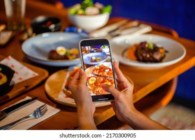 Food Photography Of Salmon Toast Of Lunch Or Dinner In Luxury Restaurant. Influencer Makes Food Photography For Social Networks With Phone.