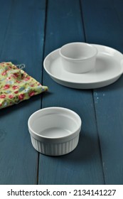 Food Photography Set Up At Home.   White Tableware, Flower Napkin And Blue Wooden Table