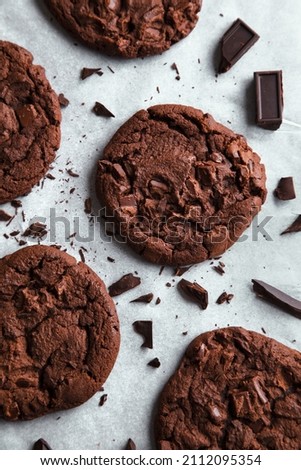Food photography of sweet double chocolate chip cookies fresh out of the oven. 
