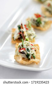 Food Photography Of Thai Style Canapés Of Fried Wonton Skins With Crab, Chilli And Coriander