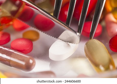 Food pills knife and fork
Diet and medical concept. Tablet drug