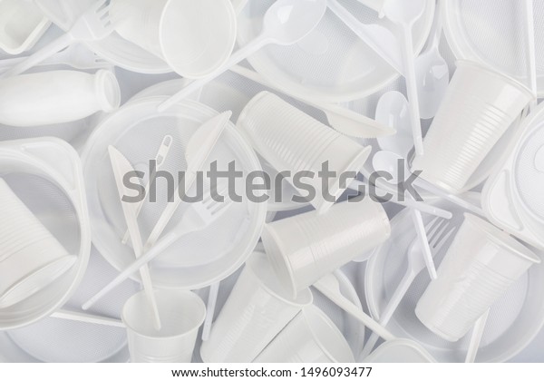 Food plastic\
on grey background. Concept of Recycling plastic and ecology.\
Plastic waste. Flat lay, top\
view