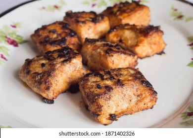 Food Plate Of Hake Loins With Lemon Sauce, Garlic, Paprika, And Butter.