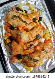 Food Preparation In Making Chicken Roasted. Four Pieces Of Chicken Whole Leg On Aluminium Foil. 