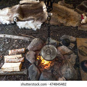 Food Is Prepared On A Fire In A Sami Lavvo