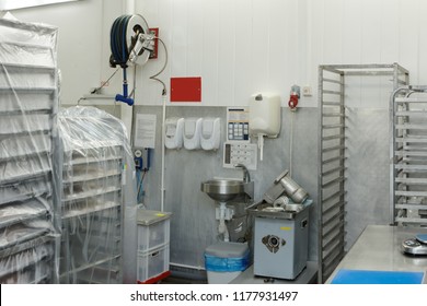 Food Processing Plant Storage Room With Rack Trolleys And Hand Washing Area