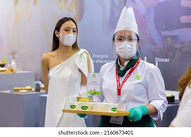 Food Products Free Sample Promote Girl Pritty Woman Model To Customer Walk In Food Expo Festival Event Hall.25 May 2022.Bangkok,THAILAND.