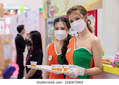 Food Products Free Sample Promote Girl Pritty Woman Model To Customer Walk In Food Expo Festival Event Hall.25 May 2022.Bangkok,THAILAND.