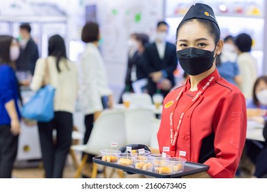 Food Products Free Sample Promote Girl Pritty Woman Model To Customer Walk In Food Expo Festival Event Hall.25 May 2022.Bangkok,THAILAND.